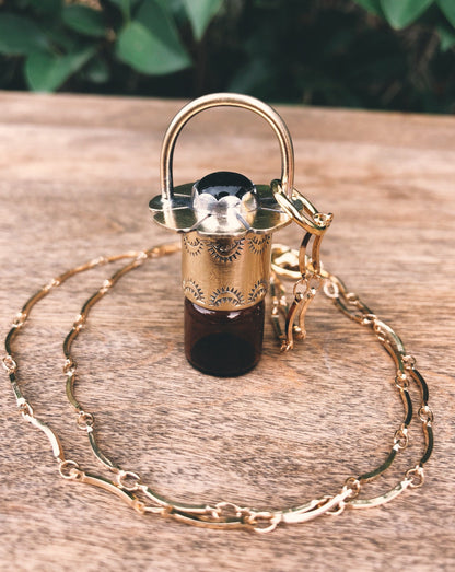 Brass Daisy - Black Onyx Rollerball Necklace